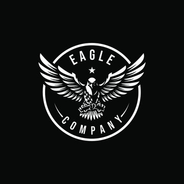 Eagle flying on dark background. Eagle Logo Template