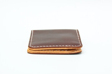 Brown natural leather wallet isolated on a white background. Closeup expensive wallet. Leather craft. Homemade.