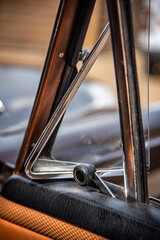 Little triangle front vent glass of a vintage, classic, luxury car from 60s