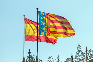 Spanish and valencian flags on the Plaza de Toros de Valencia - obrazy, fototapety, plakaty