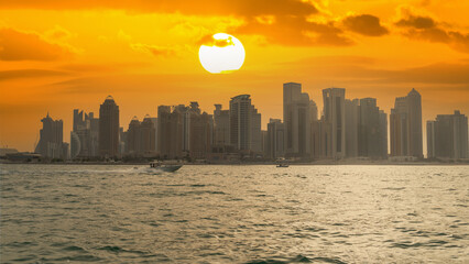 Fototapeta na wymiar Doha, Qatar- May 15,2022 : Doha skyline with many towers during a summer day.