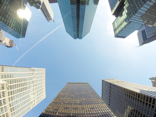Glazed skyscraper from below with wide angle and blue sky