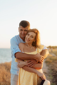 Happy romantic middle aged couple are by the sea. Closeup photo.