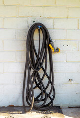 Water hose hanging on wall