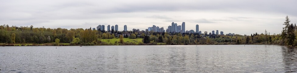 Fototapeta na wymiar Scenic view of a modern city park by the lake. Spring Season. Deer Lake, Burnaby, Vancouver, British Columbia, Canada. Panorama