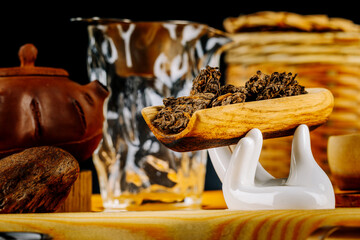 Chinese Pu-erh tea on a wooden stand. Tea ceremony