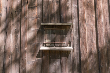 Wood hatch in a wood house façade a sunny day in Stockholm