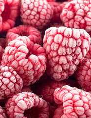 Berries background - Frozen raspberries covered with hoarfrost. Summer berries, top view.