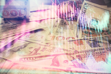 Multi exposure of forex chart drawing over us dollars bill background. Concept of financial success markets.