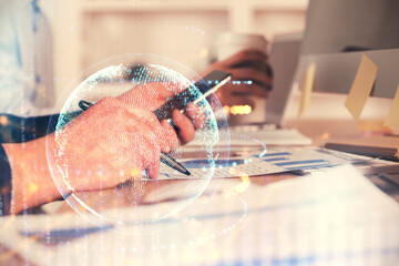 Multi exposure of man's hands holding and using a digital device and map drawing. International business concept.