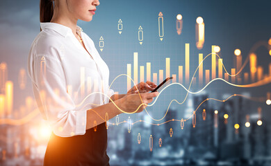 Businesswoman in formal wear is working on smartphone