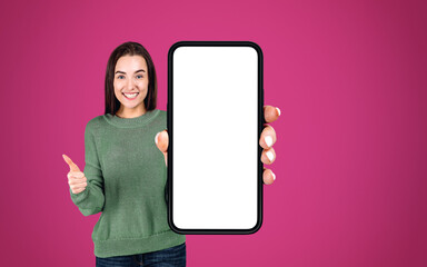 Young woman with thumb up and phone mockup display, Fuchsia back