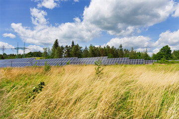 Fototapeta na wymiar Solar Power Station in the sunny cloudy spring Nature