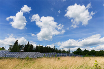 Solar Power Station in the sunny cloudy spring Nature