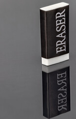 white and black eraser with reflection