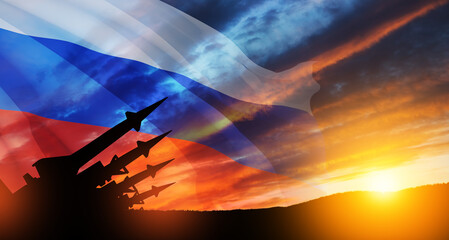 The missiles are aimed at the sky at sunset with Russian flag. Nuclear bomb, chemical weapons, missile defense, a system of salvo fire. 3d-rendering.