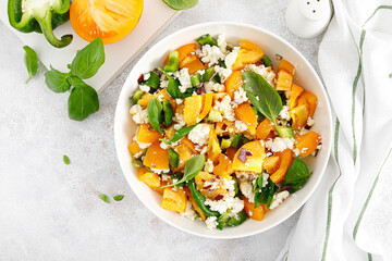 Yellow tomato salad with green paprika, cottage cheese and basil. Healthy food, diet. Top view
