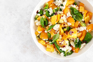 Yellow tomato salad with green paprika, cottage cheese and basil. Healthy food, diet. Top view