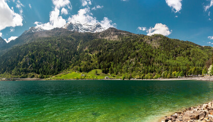 Fantastic view on the lake and mountains in Switzerland. Cristal clean water and snowy Alps....