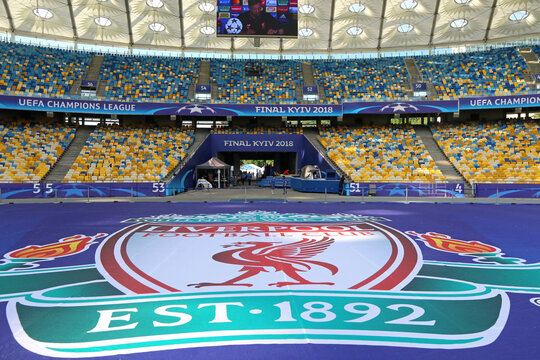 Banner with Liverpool logo (coat of arms) on pitch of NSC Olimpiyskiy Stadium before UEFA Champions League Final 2018 game Real Madrid v Liverpool