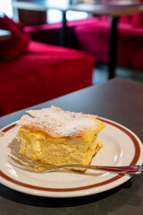 Austrian sweet dessert, filled with white cheese strudel served warm in traditional cafe in Vienna, Austria