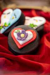 Food styling in bakery, wedding or happy valentine cakes and candies decorated with chocolate hearts and flowers