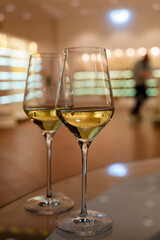 Tasting of brut champagne sparkling wine produced by traditional method in underground caves