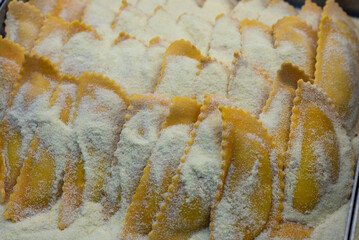 Italian food, handmade mezzaluna pasta ravioli stuffed with four cheeses