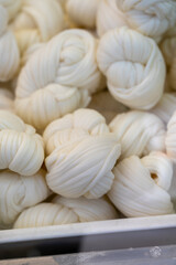 White soft braid cheese on market display