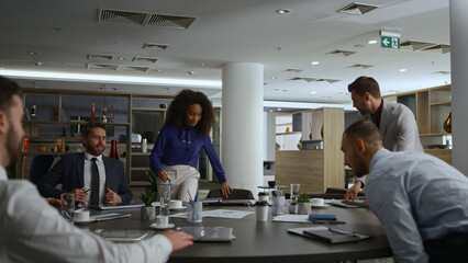 Fototapeta premium Multiracial office team discuss corporate data on business conference meeting.