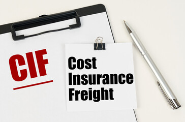 On the tablet, a sheet of paper and stickers with the inscription - CIF, Cost Insurance Freight