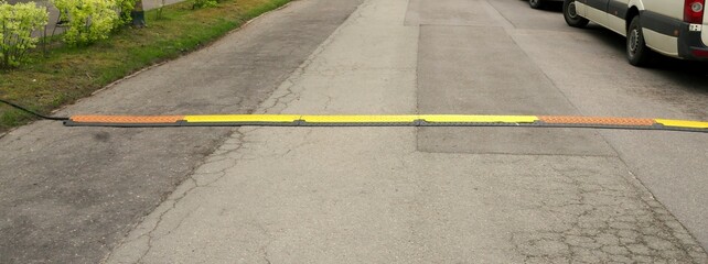 Protective cable cover for stage, outdoor events. Cable protection system. Selective focus.