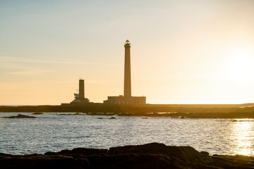 Fototapeta premium The gatteville lighthouse in Normandy during the sunrise