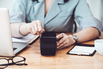 card swipe machine, cyber security, convenience of payment, staff use EDC card machine to swipe customer credit card to make in-store purchases