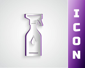 Paper cut Cleaning spray bottle with detergent liquid icon isolated on grey background. Paper art style. Vector