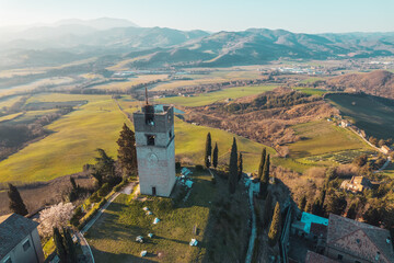 Aerial view of Peglio tower in village
