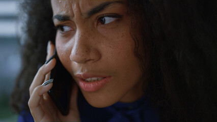 Sad entrepreneur woman using smart phone device talking client in office closeup