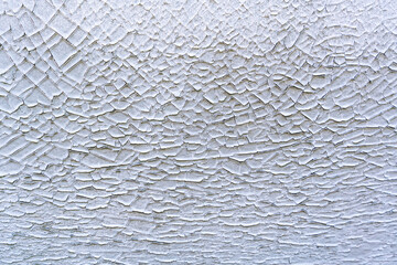 Old cracked paint on the concrete wall