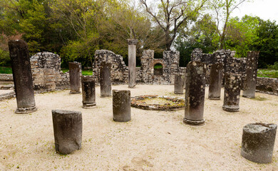 Fototapeta premium Ruins of Butrint Baptistery in Albania. View of stone columns and walls.