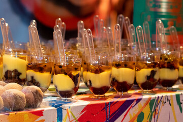 cups with chocolate and passion fruit syrup, condensed milk candy