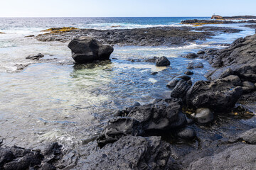 Fototapeta na wymiar The Rugged Volcanic Coastline at Keahole Point, Hawaii Island, Hawaii, USA