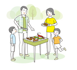 バーベキューを楽しむ家族