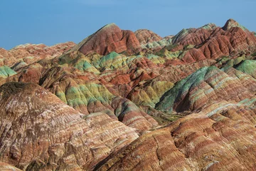 Photo sur Plexiglas Zhangye Danxia Natural toning of red, green, yellow, orange layers of the Chinese rainbow mountains of Zhangye Danxia National Geological park, Gansu, China
