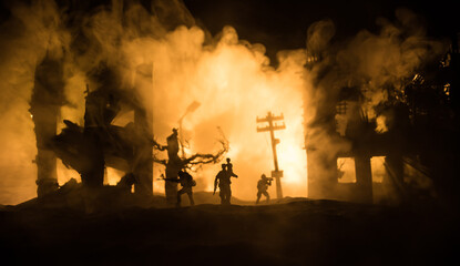 Silhouette soldier carrying little boy on his shoulder from fire. Rescue savior concept. Man moving...