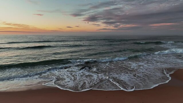 Sunrise seascape with clouds at Shelly Beach on the Central Coast, NSW, Australia.