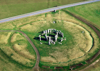 Stonehenge prehistoric stone circle, Wiltshire, England. Looking N.E. the A344 road intersects 'The...
