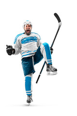 Athlete in action. Very emotional hockey player with stick and puck in his hands. Sports emotions....