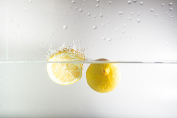 lemon dropping in water splash