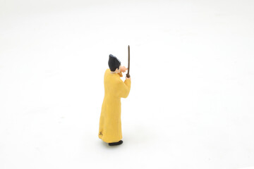 a scale of mini Taoist priest figure on board