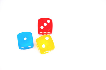 Colored dice in overhead shot isolated on a white background